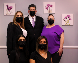 all staff members and DR. ERIC DESMAN using masks
