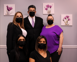 all staff members and DR. ERIC DESMAN using masks