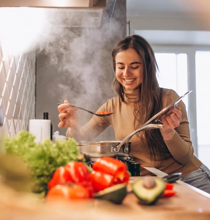 smiling woman cooking 