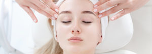 face of a woman receiving a massage